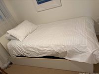 Daybed set up with bedding, side view