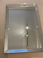 Front view showing rectangular mirror and beveled mirrored border