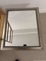 Front view of rectangular silver framed mirror