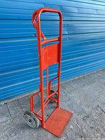 Front view of red 2-wheel dolly cart