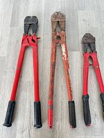 Three bolt cutters laid out side by side