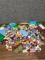Pile of assorted LEGO pieces on floor