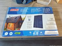 Front of boxed Coleman solar panel showing product image and specifications