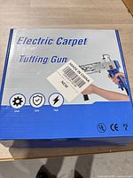 blue box labeled Electric Carpet Tufting Gun