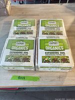 Four bricks of Expert Gardener Organics Expanding Soil on table