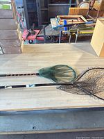 Two fishing nets on table