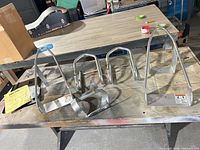 All five wheel mounts laid out on workbench