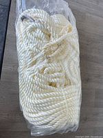 Full coil of rope sealed in plastic bag