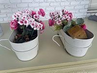 Both white rail planters side by side on surface