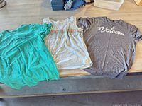 All three shirts laid out on table