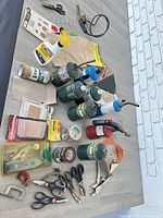 Top view of all items including gas cylinders, scissors, pliers, clamps, sandpaper and packaged tool