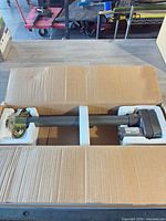 Open box showing linear actuator secured in foam inserts