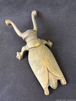 Full view of brass insect door stop front