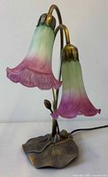 Lamp unlit, showing twin glass shades and lily pad base