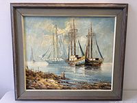 Front view of framed marine oil painting, signature visible