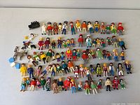 All Playmobil figures, animals, accessories spread out