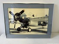 Framed photograph front view showing aircraft details and framing