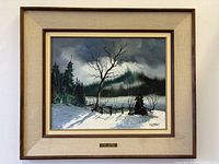 Front view of framed winter landscape painting