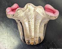 Top view showing ruffled fluted rim and gold flecks