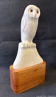 Front view of soapstone owl on wood plinth