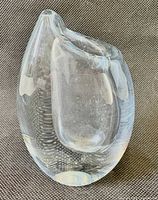 Front view showing overall teardrop form and jagged rim