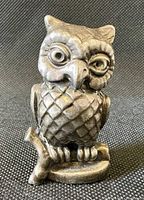 Front view of sterling silver owl figurine on branch
