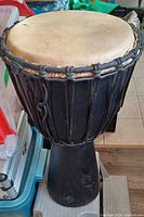 Full view of djembe showing body and ropes