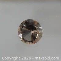 Front view of round faceted smoky quartz
