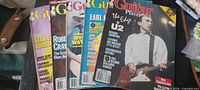 Five Guitar Player magazines fanned out showing covers