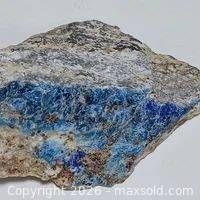 Front view of blue hauynite crystals on quartz marble matrix