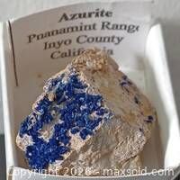 Azurite specimen in display box with locality label