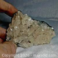 Front view of calcite crystal cluster showing drusy surface