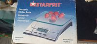 Front of Starfrit electronic kitchen scale box showing product image and specifications
