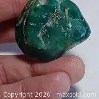 Front view of blue-green jade showing polished surface and color
