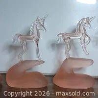 Two pink glass unicorn figurines front view