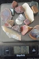 All stones on digital scale reading 319 g