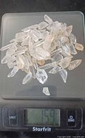 All quartz points on scale showing 159 g total weight