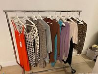 Full rack showing nine dresses