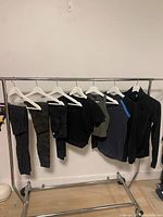 Full rack view showing all seven garments