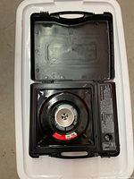 stove inside open carry case showing burner and control panel
