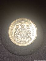 Reverse side showing CANADA 1976 50 CENTS and Coat of Arms
