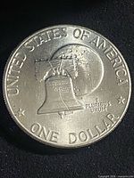 Reverse of Eisenhower bicentennial dollar showing Liberty Bell over Moon
