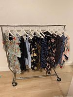 Full rack of eleven dresses on hangers
