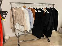 full rack showing eight garments on hangers