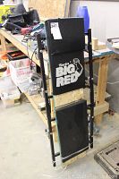 Top view of Torin Big Red automotive dolly showing padded surface with brand logo.