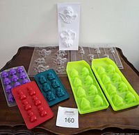 Group view of all silicone and plastic candy moulds on table