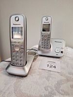 Two Panasonic cordless handsets on their bases