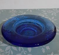 Top angled view showing overall shape, wide rim and central recess