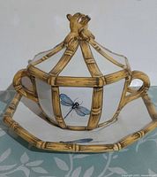 Front view of Costa majolica lidded bowl on underplate