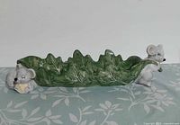 Full side view of leaf dish showing both mice figures